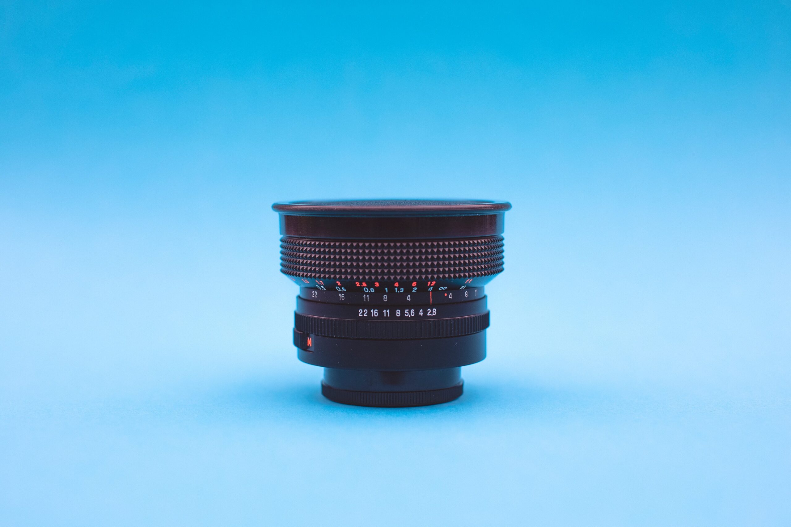 wide angle vintage lens on blue background