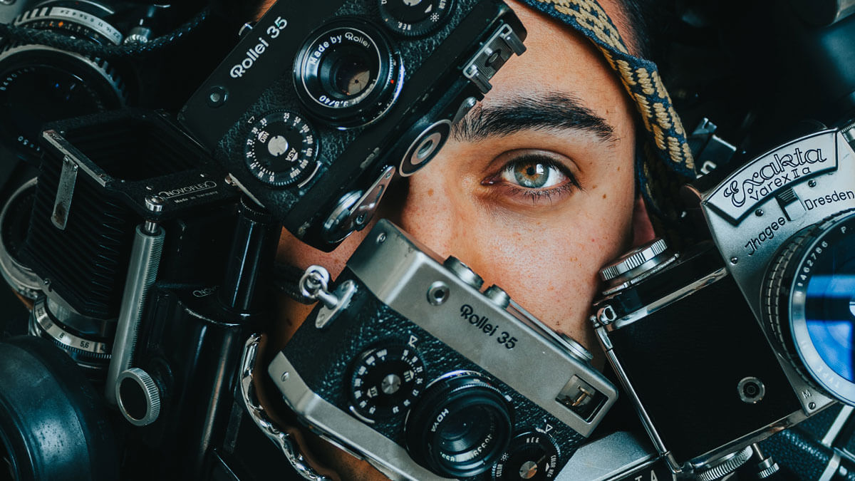 girls-face-behind-vintage-cameras