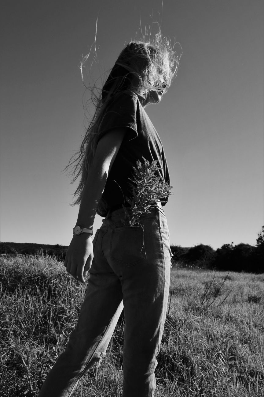 vintage portrait of a girl on a field in black and white