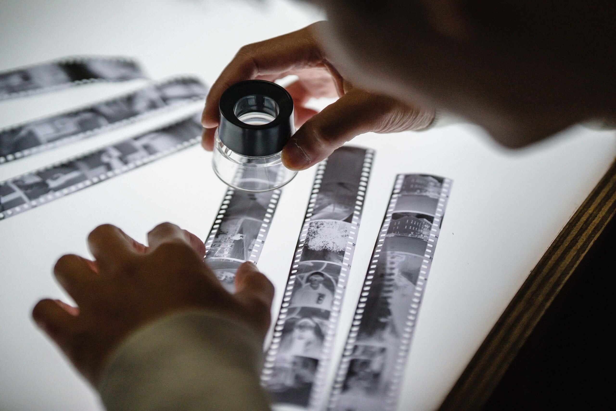 checking film negatives on a light tables